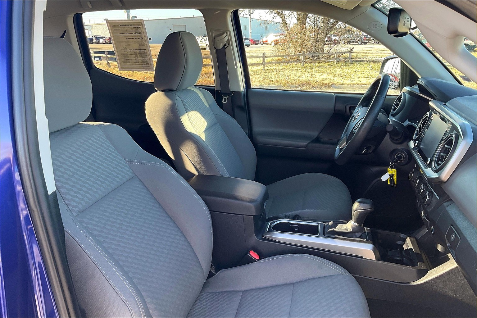What is the best product to clean the interior of a Tacoma, the dash, door  panels and around the Instrument panels? I have seat covers that match the  seats in my 22