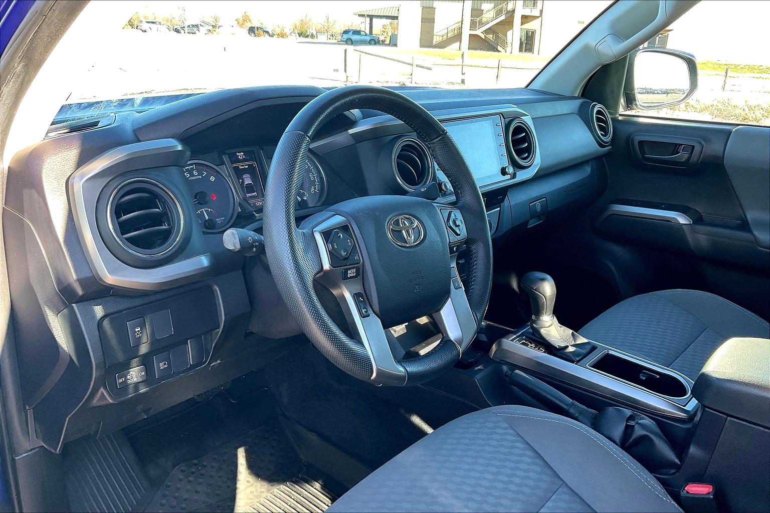 What is the best product to clean the interior of a Tacoma, the dash, door  panels and around the Instrument panels? I have seat covers that match the  seats in my 22